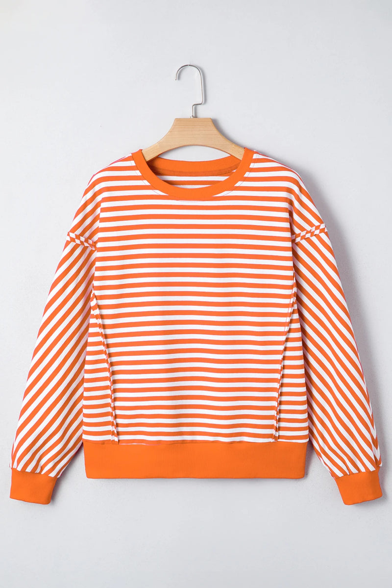 Load image into Gallery viewer, DLLS422 - Ladies Orange Stripe Exposed Seam Drop Shoulder Casual Pullover Top
