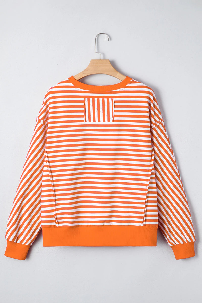 Load image into Gallery viewer, DLLS422 - Ladies Orange Stripe Exposed Seam Drop Shoulder Casual Pullover Top
