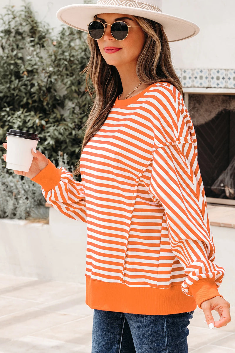 Load image into Gallery viewer, DLLS422 - Ladies Orange Stripe Exposed Seam Drop Shoulder Casual Pullover Top

