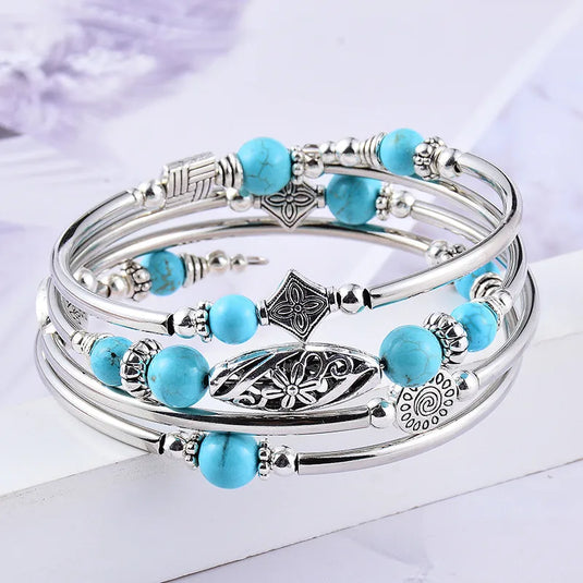 NIHBC48 - Cylindrical Metal Bracelet w/ Turquoise Beads