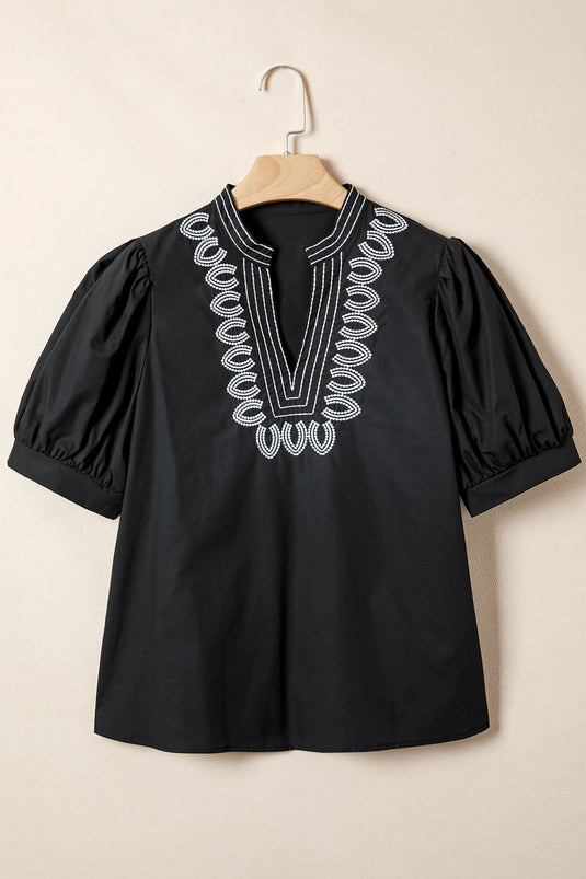 DLLS364 - Ladies Black Short Puff Sleeve Contrast Embroidered Detail V Neck Blouse