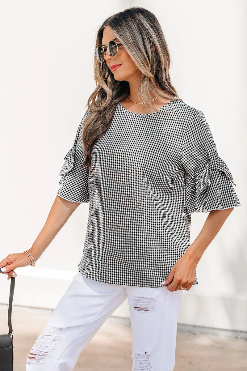 Load image into Gallery viewer, DLLS632 - Ladies Black Plaid Bow Ruffled Half Sleeve Round Neck Blouse
