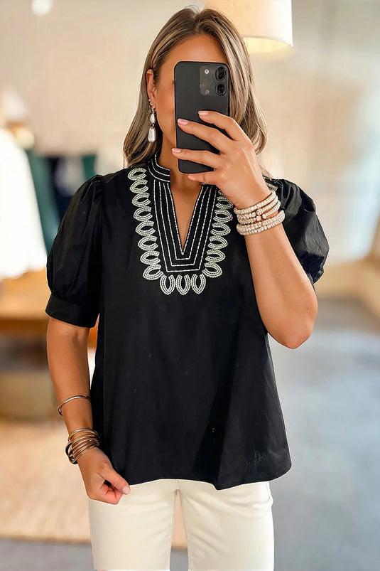 DLLS364 - Ladies Black Short Puff Sleeve Contrast Embroidered Detail V Neck Blouse